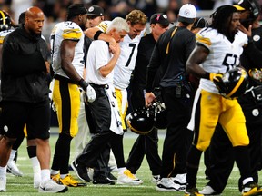 Pittsburgh Steelers quarterback Ben Roethlisberger (7) is helped off the field after being injured during the third quarter against the St. Louis Rams at The Edward Jones Dome.  Joshua Lindsey-USA TODAY Sports