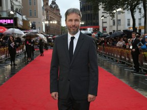 Director Denis Villeneuve poses for photographs as he arrives for the U.K. premiere of Sicario, at a central London cinema, on Sept. 21, 2015. (Photo by Joel Ryan/Invision/AP)