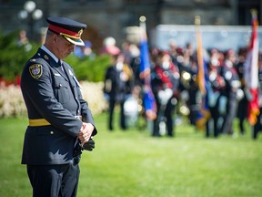 Police and peace officers from all over Canada gathered on Parliament Hill Sunday, Sept. 27, 2015 for the 38th annual Canadian Police and Peace Officers' Memorial Service. They were joined by hundreds of civilians showing their support. The event honours officers who have died in the line of duty. Here Ottawa police Supt. Don Sweet pauses to pay his respects.
DANI-ELLE DUBE/Ottawa Sun