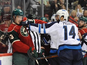 Sep 27, 2015; Saint Paul, MN, USA:  Minnesota Wild center Tyler Graovac (53) and Winnipeg Jets forward Anthony Peluso (14) exchange words during the second period at Xcel Energy Center. Mandatory Credit: Marilyn Indahl-USA TODAY Sports