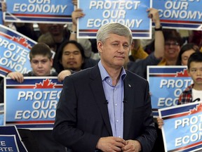 Conservative Leader Stephen Harper pauses while speaking during a campaign event at a factory in Stittsville, Ont., Sept. 13, 2015. REUTERS/Chris Wattie