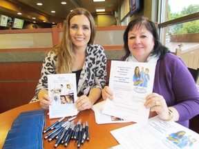Natasha Milosavlecski, left, and Donna Wurbel, nurse recruiters from the Henry Ford Health System in Michigan, set up shop at a Tim Hortons on Exmouth Street on Monday September 28, 2015 in Sarnia, Ont. They were looking for experienced nurses from the Sarnia area to work for the health system in Michigan. (Paul Morden/Sarnia Observer/Postmedia Network)