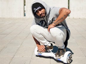 Darren Pereira, whose company Huuver has begun to sell its Uuboard brand of self-balancing electric boards online, poses for a photo in Toronto, Wednesday, Sept, 23, 2015. THE CANADIAN PRESS/Marta Iwanek