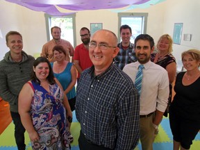 Dr. Paul Dempsey, centre, stands with some of his new tenants at Quinte Pediatrics and Adolescent Medicine in Belleville Sept. 18. Behind him from left are Quinte Pediatrics' Jack McGowan; Quinte Parents' Leanne Ballard; Engine Communications' Brandon Bisson, Laura Brasseur, Zach Ellis, Justin Monk, and owner Shaun Levy; Family Space's Kelly Allan; and No Limits Youth Organization's Brenda Gabriel.
