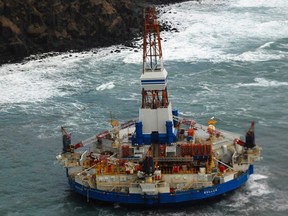 The conical drilling unit Kulluk sits grounded 40 miles (64 km) southwest of Kodiak City, Alaska in this U.S. Coast Guard handout photo taken January 3, 2012 and provided by the U.S. Coast Guard. (REUTERS/U.S. Coast Guard/Petty Officer 2nd Class Zachary Painter/Handout/Files)