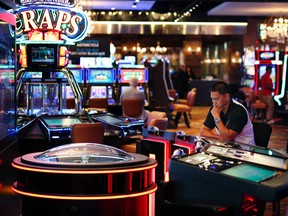 A man plays an electronic roulette game at the Downtown Grand hotel and casino in Las Vegas. As gamblers move away from traditional slot machines, game-makers and casinos are looking at new ways to keep people playing. (AP Photo/John Locher)
