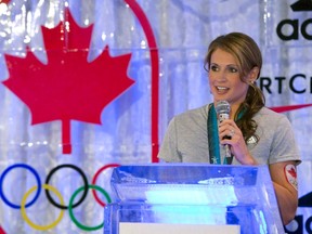 Canadian hockey player Meaghan Mikkelson speaks at an event announcing the sponsorship of the team by Adidas in Toronto on Tuesday June 25, 2013. From Twitter suggestions such as Molson, Gretzky, Ziam, Flash and Stryder, Mikkelson has chosen the name Calder for her newborn son. THE CANADIAN PRESS/Frank Gunn