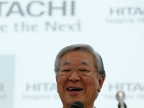 Hitachi Ltd. chief executive Hiroaki Nakanishi smiles during a news conference in Tokyo Feb. 24, 2015.  REUTERS/Issei Kato