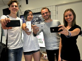 Western students Valentine Waskevitch (left), Jin Shi, David Tasker, and Jodi Paulin at the University Community Centre in London Ont. September 9, 2015. They are organizing the new Western University Smartphone Film Festival at the campus’ McKellar Theatre this upcoming January. CHRIS MONTANINI\LONDONER\POSTMEDIA NETWORK