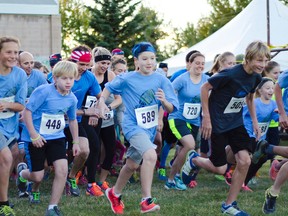 Runners doing the 5 and 10 kilometre route of the first annual Moonshadow run bolt from the starting line in Pincher Creek on Saturday, Sept. 26. John Stoesser photos/Pincher Creek Echo.