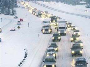 Traffic slowly moving along Interstate 70 in Vail, Colo. Colorado is converting a shoulder lane on the mountainous highway into an express lane. (Preston Utley/AP)