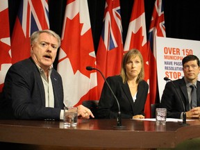 Sarnia Mayor Mike Bradley (from left), Keep Hydro Public spokesman Katrina Miller and Whitby Councillor Chris Leahy call for a larger public debate on the partial sale of Hydro One Monday, September 28 2015 (Toronto Sun/Antonella Artuso)