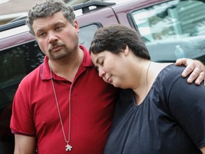 Edward Lake and his wife Jennifer Neville-Lake, parents of the three children who were killed at Kipling Ave. and Kirby Rd. in Vaughan, outside their home on Abell Dr. in Brampton Monday September 28, 2015. (Dave Thomas/Toronto Sun)