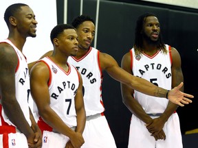 (L-R) Terrence Ross, Kyle Lowry, DeMar DeRozan and DeMarre Carroll pose for pictures during Raptors Media Day as the Raptors start their preseason at the Air Canada Centre in Toronto, Ont. on Monday September 28, 2015. Dave Abel/Toronto Sun/Postmedia Network