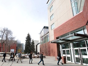 Students walk to class outside the Faculty of Engineering at the University of Alberta in Edmonton, Alta., on Friday, April 4, 2014. Ian Kucerak/Edmonton Sun