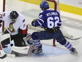 Toronto Maple Leafs forward William Nylander watches his shot go through the legs of Ottawa Senators goalie Matt O’Connor at the 2015 NHL Rookie Tournament Friday September 11, 2015 in London. (THE CANADIAN PRESS/Dave Chidley)