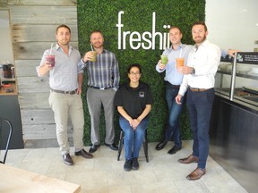 London?s first Freshii site opened in One London Place. The healthy food chain was founded by Western grad Matthew Corrin. The London shop is owned by partners (L-R) David Gilvesy, Shane Curtis, Chris Declark and Jason Wilcox. Seated is manager Geraldine Lazo. (HANK DANISZEWSKI, The London Free Press)