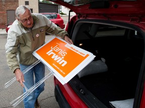Campaign volunteer Robert Bruinsma loads campaign signs into his car as volunteers for Edmonton Griesbach NDP candidate Janis Irwin begin their first sign blitz, at Irwin's campaign office, 9540 - 111 Ave., in Edmonton Alta. on Saturday Aug. 15, 2015. David Bloom/Edmonton Sun