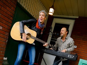 Stephanie Halin and Ken McKay, co-founders of Ottawa's first PorchFest, ham it up on Monday, Sept. 28, 2015 while playing some music on their porch in Hintonburg. The inaugural event takes place on Oct 24, 2015. 
Errol McGihon/Ottawa Sun