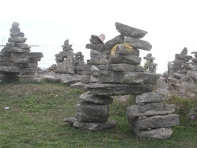 About 200 stone way-markers, known as Inukshuks, have been spontaneously assembled at Goderich?s Cove Beach during the past few months. The town is doing a safety audit of the structures. (DAVE FLAHERTY, Postmedia Network)
