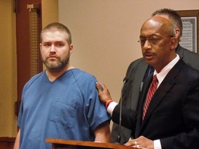 Matthew Skalitzky, left, appears in Dane County court Monday Sept. 28, 2015, with his lawyer Stan Woodard in Madison, Wis. Skalitzky is charged with first-degree intentional homicide for allegedly beheading his mother with a 4-foot sword. (Ed Trevelen/Wisconsin State Journal via AP)