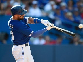 Toronto Blue Jays' Kevin Pillar connects for a double to drive in the game-tying run against the Tampa Rays during eight inning American League action in Toronto on Sept. 27, 2015. Pillar was named American League player of the week Sept. 28, 2015, after batting .524 with two homers and six RBIs over six games last week. (FRANK GUNN/The Canadian Press)