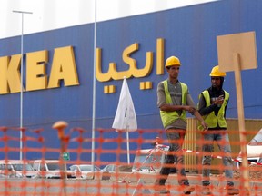 Moroccan workers walk past the construction site of the country's first Ikea store outside Casablanca, Morocco, Tuesday, Sept. 29, 2015. Morocco’s government has suspended the opening of the country’s first Ikea store, in a last-minute decision reportedly linked to Sweden’s diplomatic position on Moroccan-controlled Western Sahara. (AP Photo/Abdeljalil Bounhar)