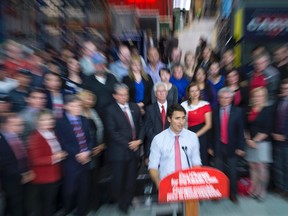 Liberal leader Justin Trudeau addresses workers and supporters as he tours an electric transformer manufacturer Tuesday, September 29, 2015 in Winnipeg. THE CANADIAN PRESS/Paul Chiasson