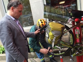 Cyclist Michael Black fixes his bike at a TTC repair station.