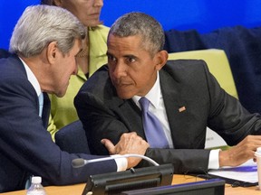 U.S. Secretary of State John Kerry (L) speaks to U.S. President Barack Obama (R) during the Leaders' Summit on Countering ISIS and Violent Extremism at the United Nations General Assembly in New York September 29, 2015.  REUTERS/Darren Ornitz