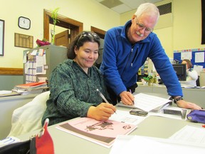 Corine Lawrence and volunteer Tom Rodger are shown in this file photo in an adult program offered by the Organization for Literacy in Lambton. The agency was one of many receiving funding this year from the Sarnia Community Foundation. File photo/ THE OBSERVER