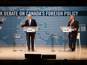 Liberal Leader Justin Trudeau, left to right, Conservative Leader Stephen Harper and NDP Leader Tom Mulcair participate in the Munk Debate on Canada's foreign policy in Toronto, on Monday, Sept. 28, 2015. THE CANADIAN PRESS/POOL-Mark Blinch