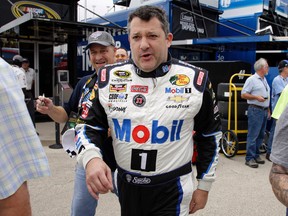Tony Stewart walks to his car during practice for the NASCAR Sprint Cup Series race at Chicagoland Speedway in Joliet, Ill., on Friday, Sept. 18, 2015. (Nam Y. Huh/AP Photo)