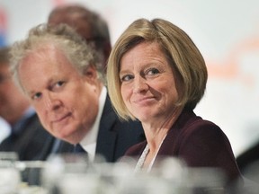 Alberta Premier Rachel Notley and former Quebec premier Jean Charest attend a business luncheon in Montrel, Monday, September 28, 2015. THE CANADIAN PRESS/Graham Hughes