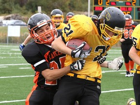 Lasalle Lancers Nick Wawia takes down Lively Hawks Brandon Sasseville during boy high school football action from James Jerome Field in Sudbury, Ont. on Tuesday September 29, 2015.