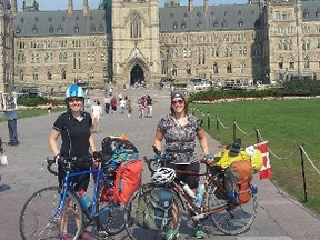 Katrina Olson (left, along with fellow rider Vikki Shembri) departed Winnipeg on Aug. 4 and hopes to complete her Bare Your Teeth bike tour in Halifax on Friday. She is raising money for the Canadian Cancer Society.