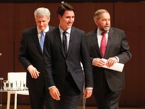 Liberal Leader Justin Trudeau, left to right, Conservative Leader Stephen Harper and NDP Leader Tom Mulcair leave the stage following the Munk Debate on Canada's foreign policy in Toronto, on Monday, Sept. 28, 2015. (THE CANADIAN PRESS/POOL-Fred Thornhill)