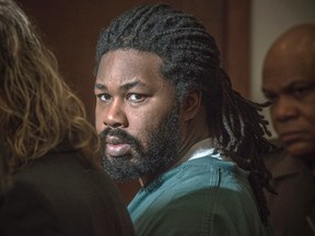 In this Nov. 14, 2014 file-pool photo Jesse Matthew Jr., right, looks toward the gallery while appearing in court in Fairfax, Va. A former girlfriend of Matthew says that he was raped as a child and that it played a key role in allegations that he raped and killed multiple women. Matthew is awaiting trial in the killings of college students Hannah Graham and Morgan Harrington — Graham's disappearance last year prompted a national search for her attacker. Matthew was arrested in Texas, and authorities say DNA from that case links him to the slaying of Harrington and a sexual assault on a woman in Fairfax County in 2005.  (AP Photo/The Washington Post, Bill O'Leary, Pool, File)
