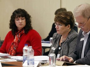 Luke Hendry/The Intelligencer
Quinte Health Board chairwoman Tricia Anderson, left, listens as president and CEO Mary Clare Egberts reports to the board during a meeting at Belleville General Hospital in Belleville Tuesday. At right is chief of staff Dr. Dick Zoutman.