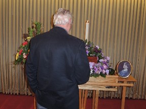 A mourner attends visitation for Nathalie Warmerdam on Tuesday in Pembroke. Warmerdam was one of three women killed in the Ottawa Valley last week. Julienne Bay/Ottawa Sun/Postmedia Network