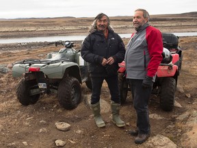 NDP Leader Tom Mulcair chats candidate Jack Anawak, left, during a trail ride at the Sylvia Grinnell Territorial Park during a campaign stop in Iqaluit, Nunavut  on Tuesday, Sept. 29, 2015. THE CANADIAN PRESS/Andrew Vaughan
