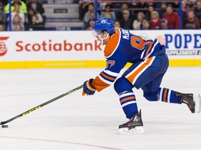 Edmonton centre Connor McDavid (97) moves the puck during the third period of an NHL game between the Edmonton Oilers and the Arizona Coyotes at Rexall Place in Edmonton, Alta. on Tuesday September 29, 2015. Ian Kucerak/Edmonton Sun/Postmedia Network