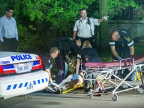Emergency personnel work on a victim after a double stabbing outside Lawrence Park Collegiate Institute Tuesday, Sept. 29, 2015. (Victor Biro photo)