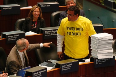 Councillor Giorgio Mammoliti presents 7,000 petitions at the taxi debate at Toronto City Hall Wednesday September 30, 2015. (Michael Peake/Toronto Sun)