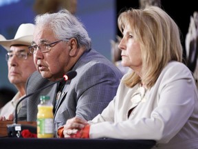 Commissioners Dr. Marie Wilson (right), Justice Murray Sinclair, and Chief Wilton Littlechild take part in a news conference at a Truth and Reconciliation Commission of Canada event in Ottawa June 2, 2015. Wilson, who grew up in Sarnia-Lambton, is schedule to speak Oct. 20 at an event at Aamjiwnaang First Nation. (REUTERS/Blair Gable)