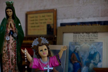 In this June 17, 2015 photo, religious figures adorn the home of Yolanda Alvarez Antunez, in Ahuehuepan, Mexico.  (AP Photo/Dario Lopez-Mills)