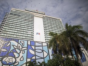 Birds fly over Habana Libre hotel in Havana, Cuba September 29, 2015. Executives from major U.S. hotel chains have stepped up their interest in the Communist island in recent months, holding informal talks with Cuban officials as Washington loosens restrictions on U.S. firms operating there. (REUTERS/Alexandre Meneghini)