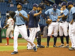 Rays relief pitcher Enny Romero (left) is pulled from the game during the 13th inning of a game on Sept. 13, 2015. Commissioner Rob Manfred is looking at more experiments to speed up the pace of the game. (Luke Johnson/AP Photo)
