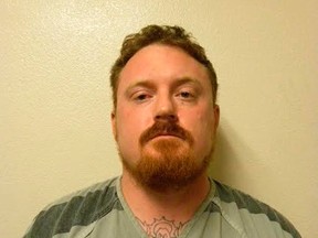 James Ashby, a police officer in the small town of Rocky Ford, is shown in this Colorado Bureau of Investigation photo released on November 14, 2014. Ashby is being held on a $1 million bond after he was arrested on Friday and charged with murder in the shooting death of a man last month, authorities said.  (REUTERS/Colorado Bureau of Investigation/Handout)