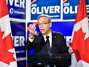 Federal finance minister and Conservative candidate Joe Oliver speaks during a press conference in Toronto on Wednesday, September 30, 2015. THE CANADIAN PRESS/Nathan Denette